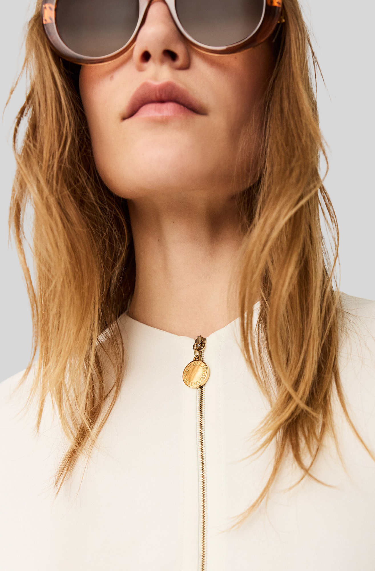 ARLESA DOUBLE SPLIT HEM ZIP BLOUSE